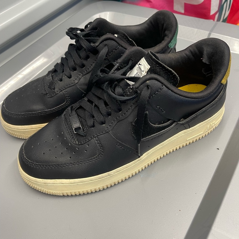 Black and Yellow Athletic Shoes “Inside out priced low due to a tear inside